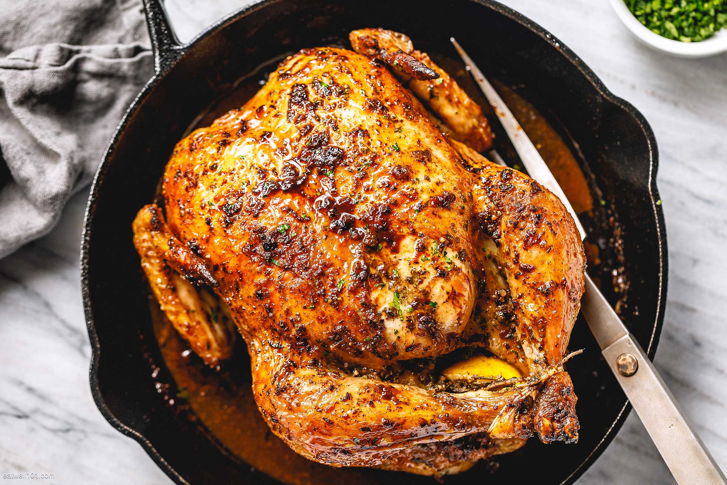A picture showing the fully cooked chicken in a black pan